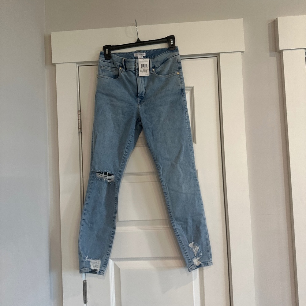 Good America fitted distressed bottoms jeans